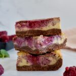 dairy free and gluten free raspberry cheesecake bars with brownie crust
