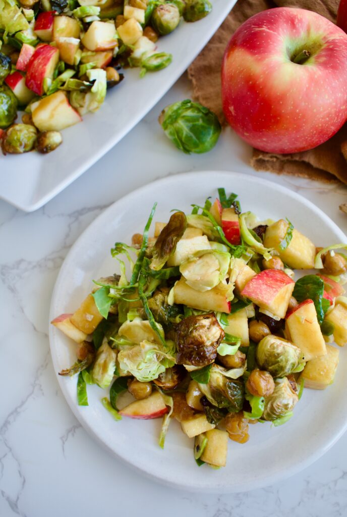 gluten free and vegetarian brussels sprout salad with apples and chickpeas