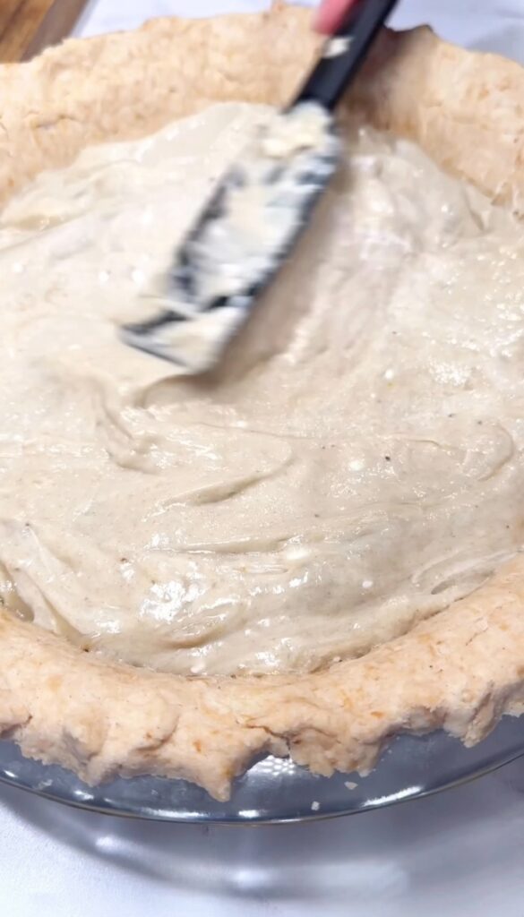 adding homemade banana pudding to vegan banana cream pie