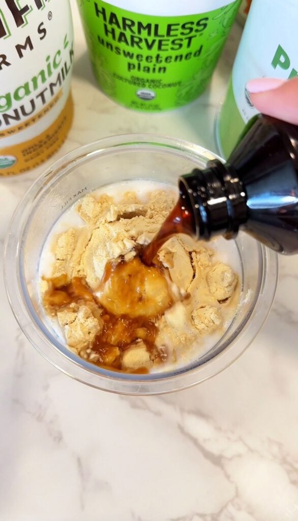 mixing all ingredients for ninja creami vegan vanilla ice cream