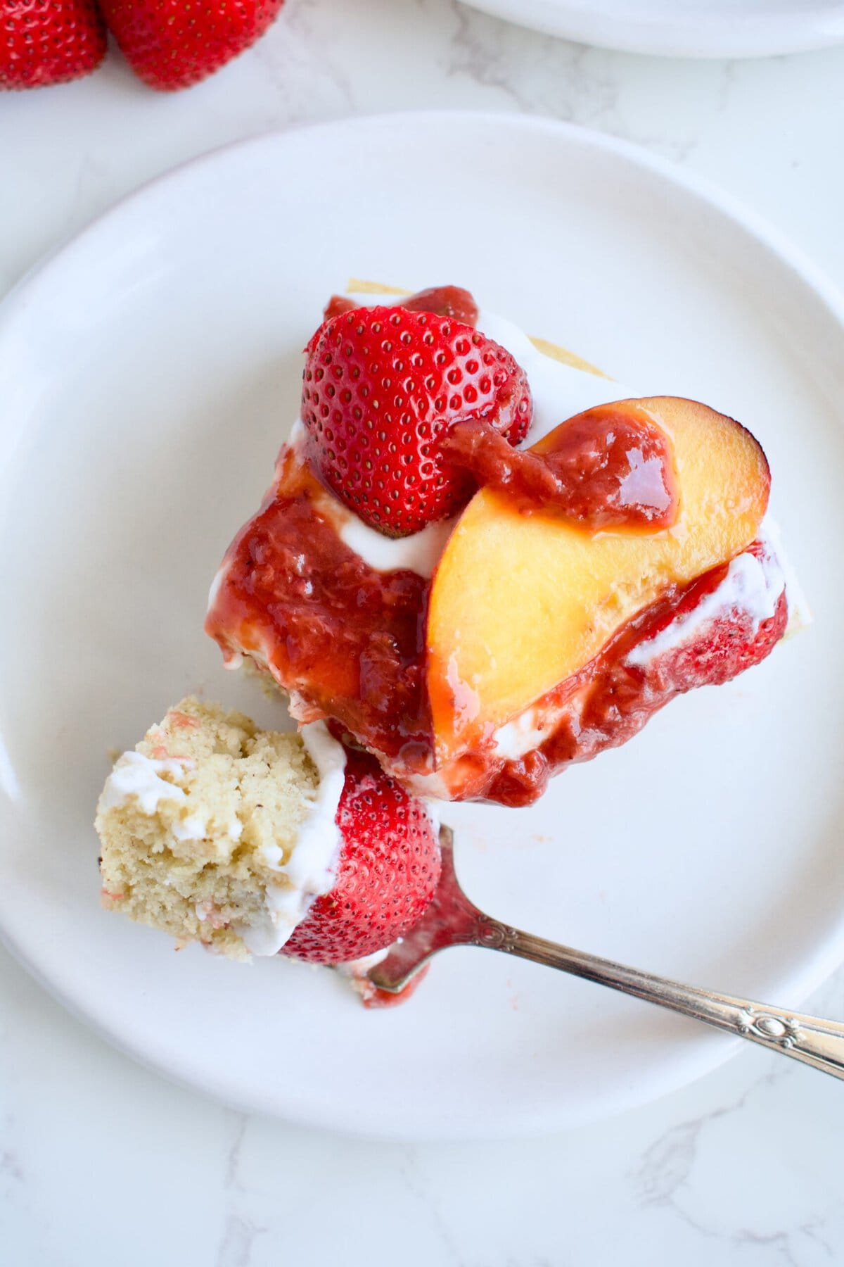 peach strawberry shortcake cake with coconut whipped cream